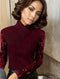 Top de manga larga de color rojo oscuro liso