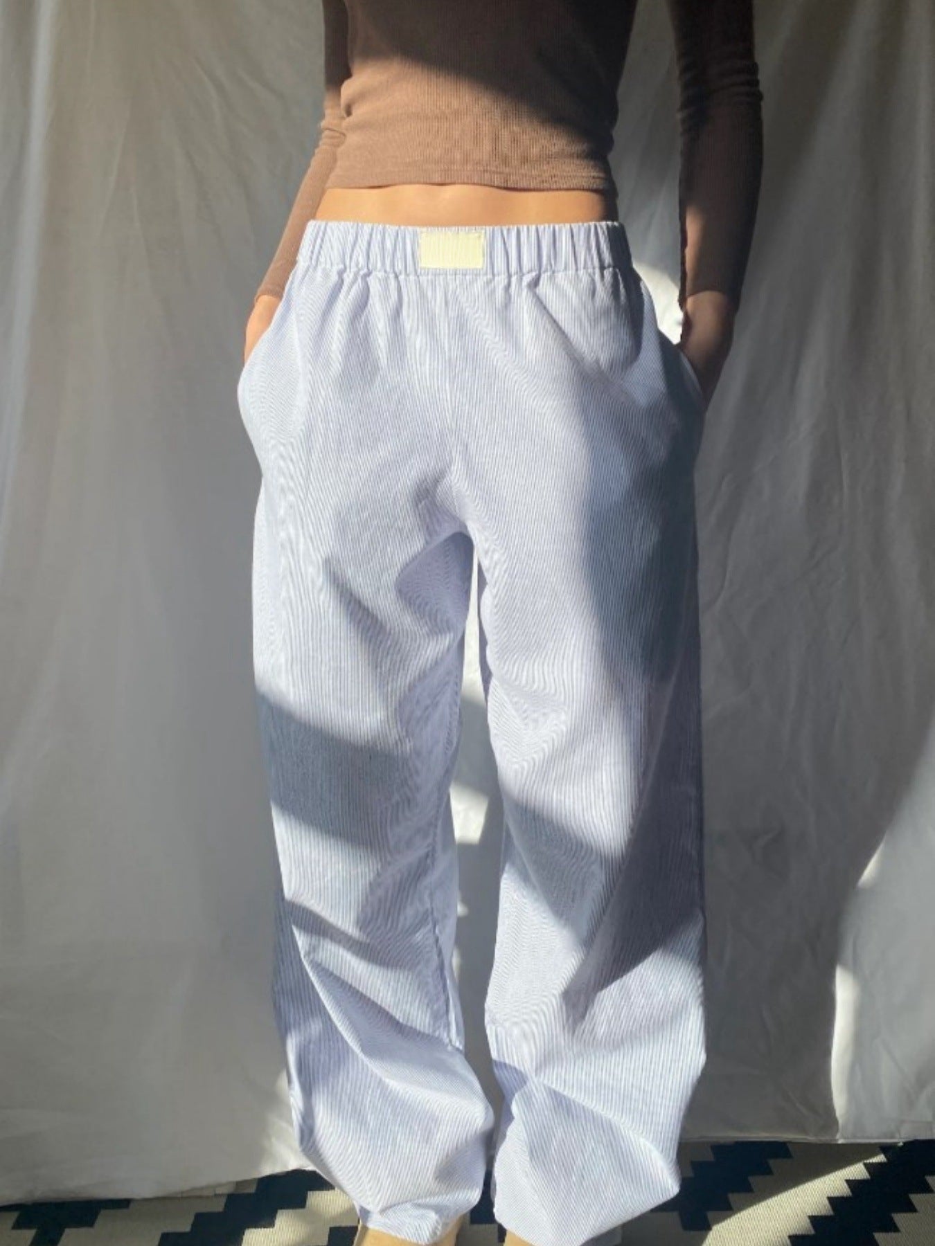 Gabrielle - Pantaloni a gamba larga con righe verticali