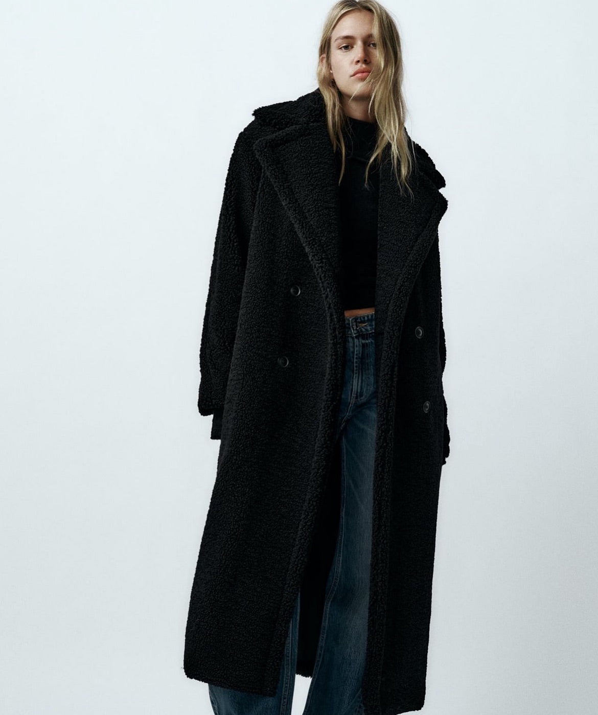 Long women's winter coat made of imitation fur with double-breasted style