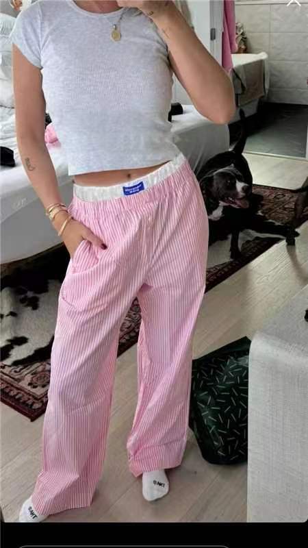 Gabrielle - Pantaloni a gamba larga con righe verticali