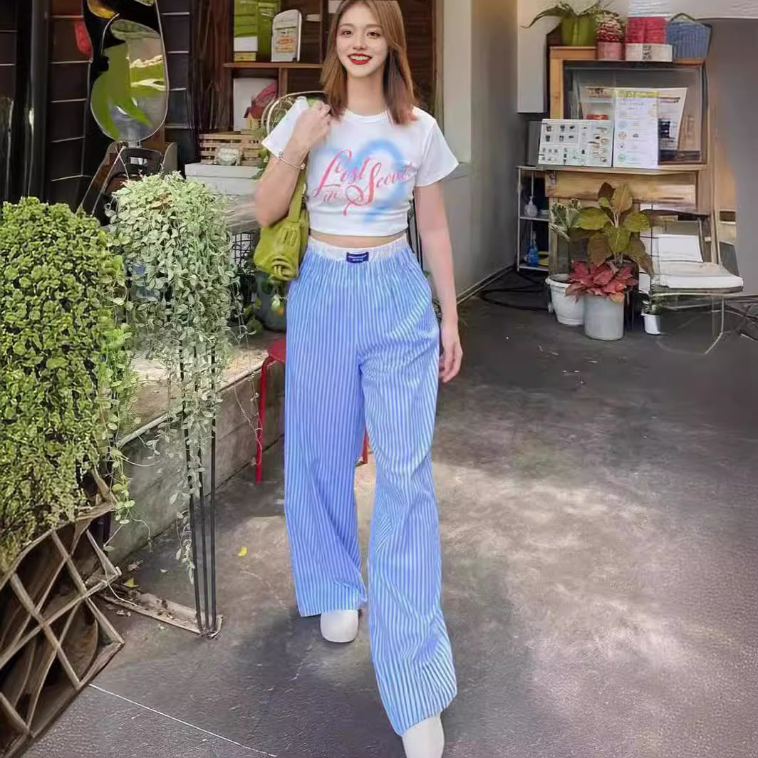 Gabrielle - Pantaloni a gamba larga con righe verticali