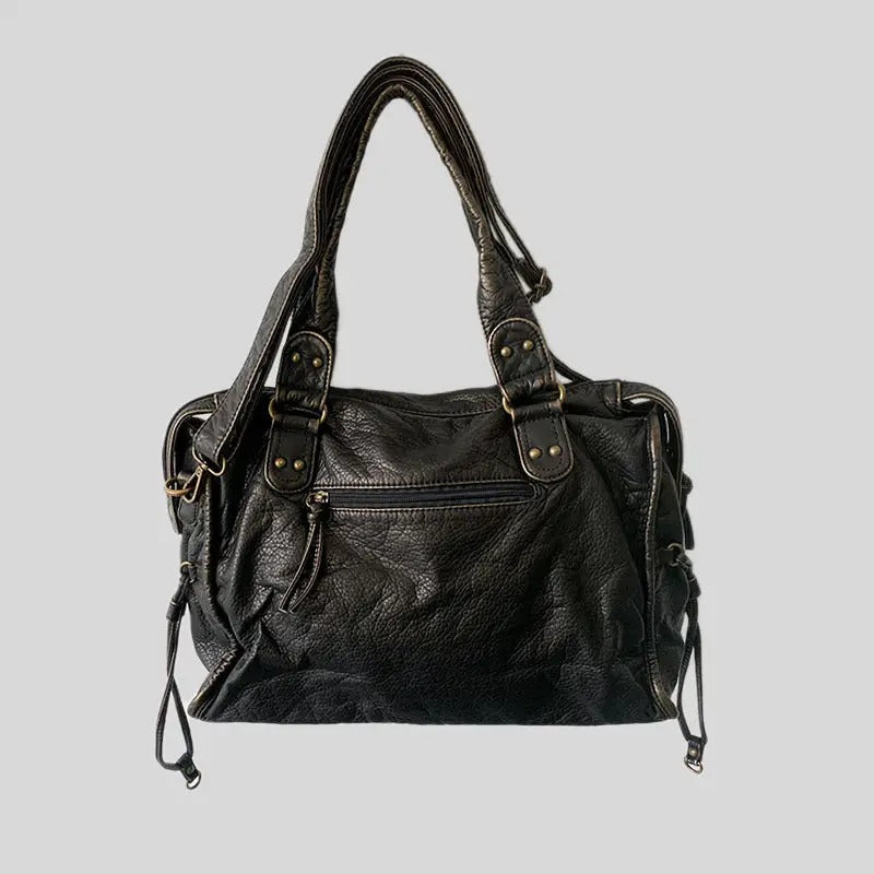 Bolso de hombro estructurado para mujer con acabado lavado y compartimentos.