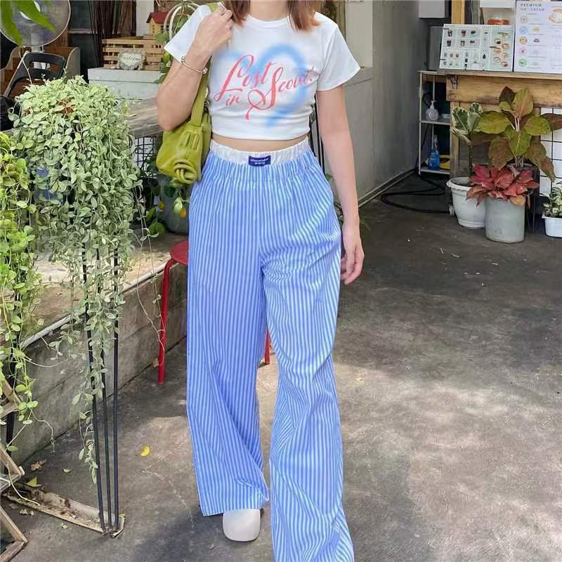 Gabrielle - Pantaloni a gamba larga con righe verticali